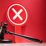 Judge Torches Maxwell Bid — Door Slammed Judge's gavel with red cross sign in background