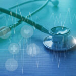 A stethoscope on a wooden surface with digital health icons and a heartbeat graph overlay