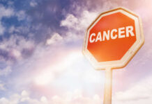 Rare Cancer Steals Rising Influencer A stop sign with the word 'CANCER' against a cloudy sky