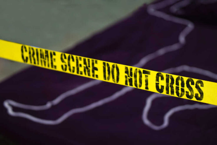 Crime,Scene,-,Do,Not,Cross.,Chalk,Outline,Of,Murdered Yellow crime scene tape marking off an area with a chalk outline