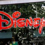 Bright red Disney logo displayed on a storefront window