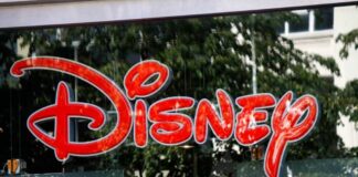 Bright red Disney logo displayed on a storefront window