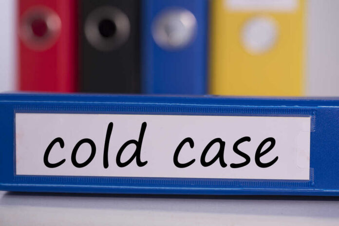 The,Word,Cold,Case,On,Blue,Business,Binder Blue binder labeled 'cold case' with other colored binders in the background