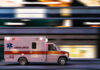 Rush-Hour Slashing Stuns Subway Platform Ambulance driving through city street at speed