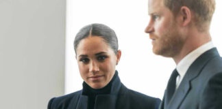 Meghan Markle and Prince Harry in formal attire looking serious.