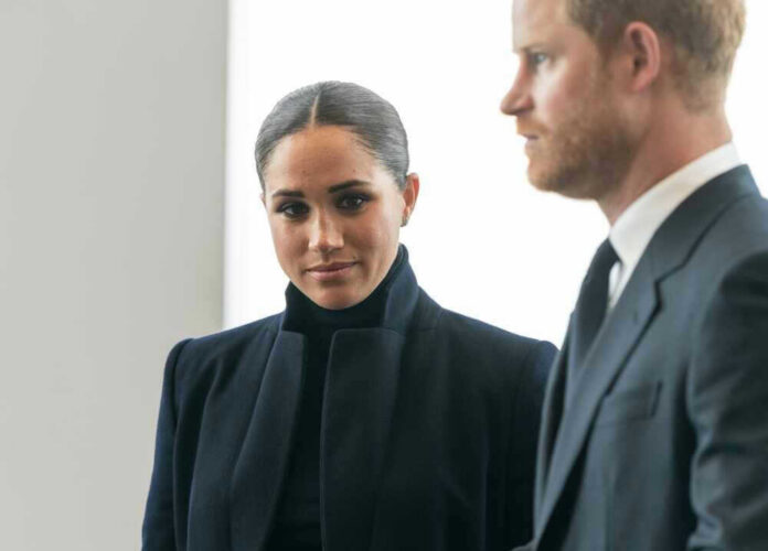 Meghan Markle and Prince Harry in formal attire looking serious.