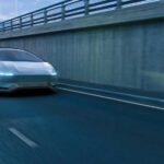 Ferrari’s Electric Car Sparks Outrage A futuristic car driving on a highway at night
