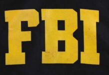 FBI Agents Exposed – Hackers Drop Chilling Proof FBI logo displayed in large yellow letters on a black background