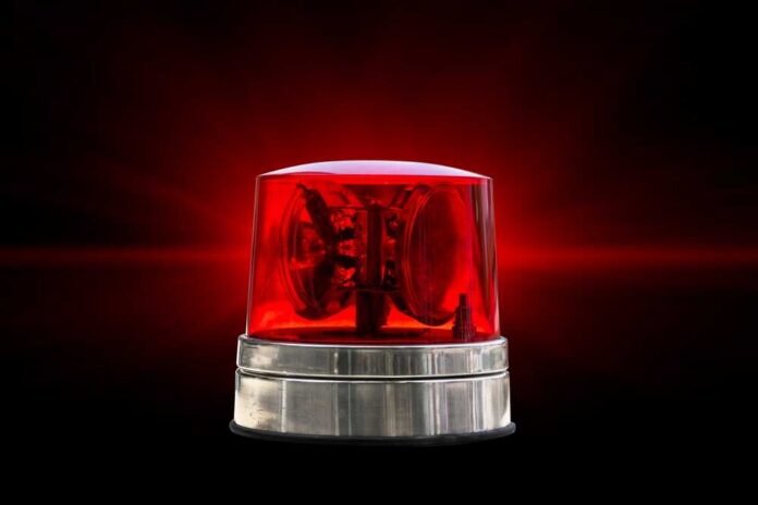 Red,Color,Emergency,Light,Warning,Vehicular,Police,Alarm,Siren,Buzzer Red emergency beacon light on a dark background