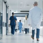 Medical staff walking through a hospital corridor