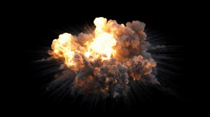 A large explosion with flames and smoke against a black background