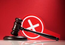 Convicted Killer Targets Judge — Case Explodes Judge's gavel with a red cross symbol in the background