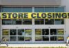 Storefront with a large 'STORE CLOSING!' banner and sale signs