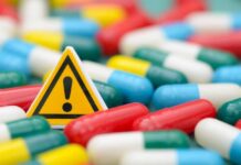 Drug Giants Blink — Trump Scores Big Win Warning sign among colorful capsules