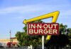 In-N-Out’s Quiet Switch Sparks Interest In-N-Out Burger sign with yellow arrow in city setting