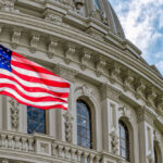 Shock Vote: Congress Draws a Red Line American flag in front of ornate building facade.