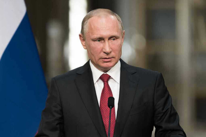 Vladimir Putin speaking at a podium with a microphone