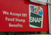 Red sign showing SNAP EBT food stamp benefits