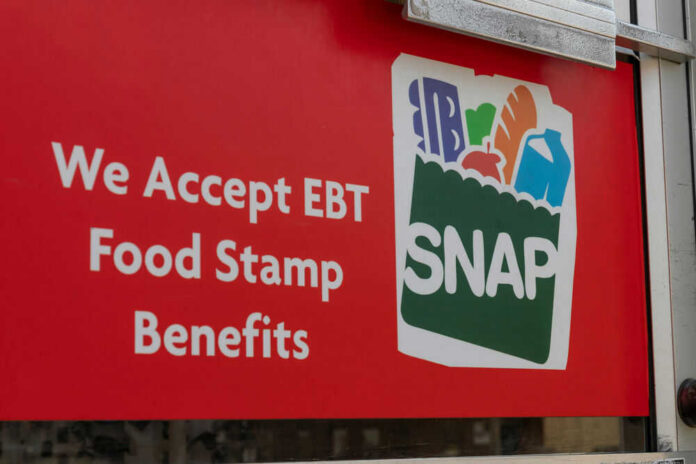 shutterstock_1757584442 Red sign showing SNAP EBT food stamp benefits