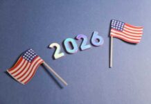 Election Emergency? Alarm Sounded Two small American flags next to the numbers 2026 on a blue background
