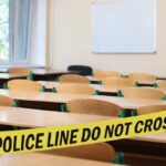 Empty classroom blocked by police tape