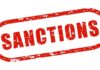 Red stamp with the word 'SANCTIONS' in bold letters