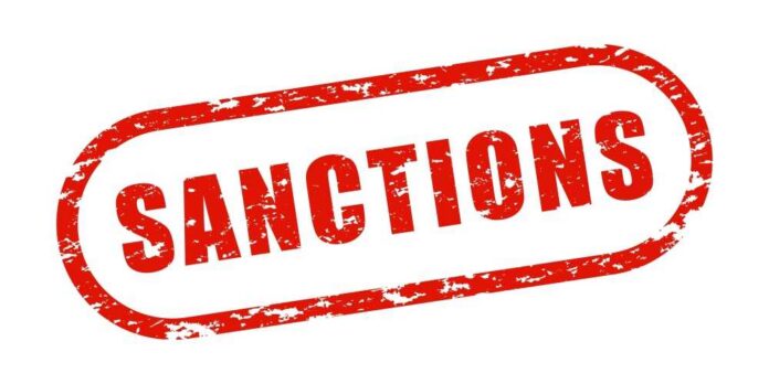 Red stamp with the word 'SANCTIONS' in bold letters