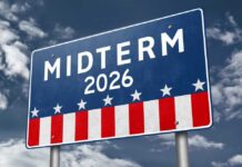 Election sign reading Midterm 2026 against a cloudy sky