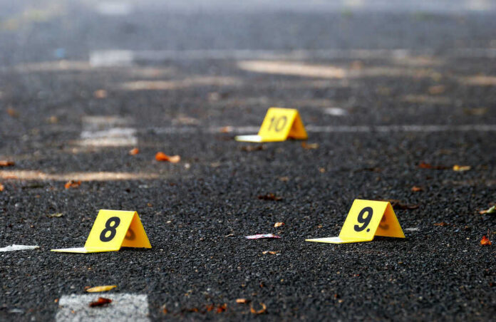 Yellow evidence markers labeled 8, 9, 10 on pavement.