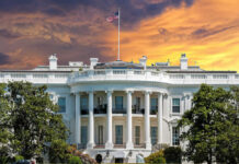 Five-Day Flameout Stuns White House The White House with vibrant sunset sky.