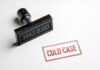 Rubber stamp with the words COLD CASE next to a stamped impression