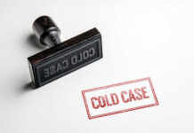 Rubber stamp with the words COLD CASE next to a stamped impression