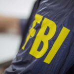 Law-And-Order Love Twist Person wearing FBI jacket, letters in yellow.